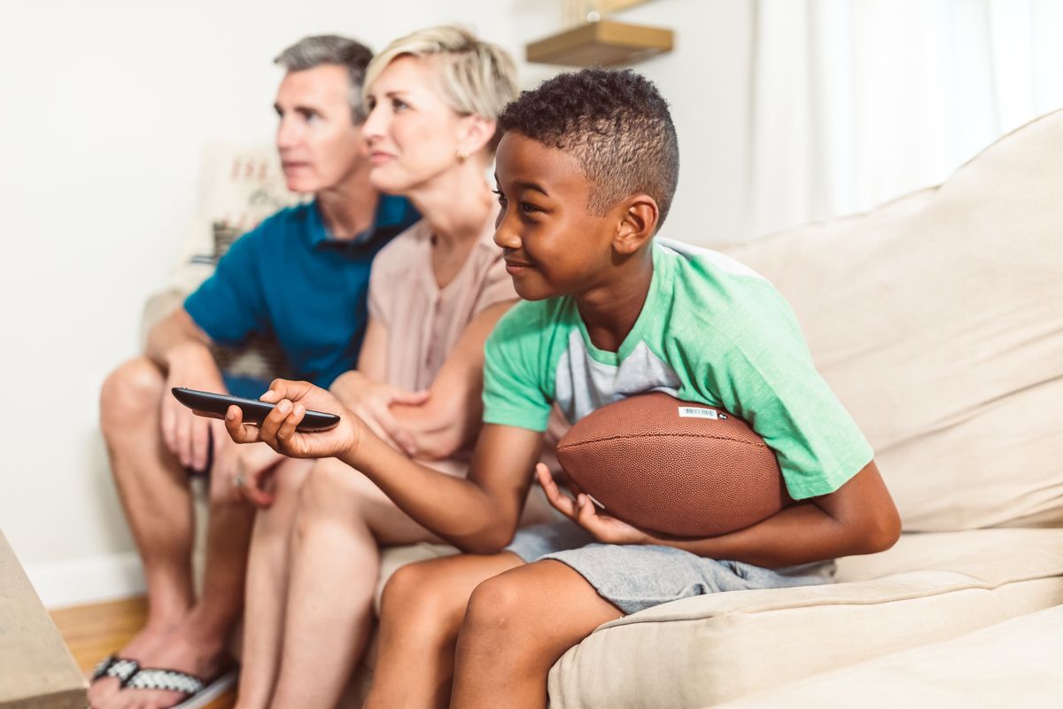 Family enjoying television together at home